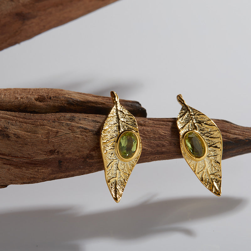 Conjunto de joyas de hojas: collar, anillo, pendientes y pulsera de granate, topacio azul y peridoto.