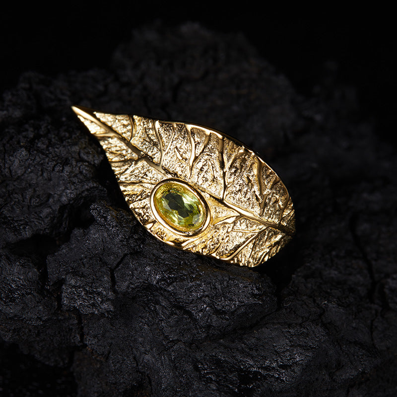 Conjunto de joyas de hojas: collar, anillo, pendientes y pulsera de granate, topacio azul y peridoto.